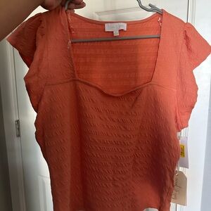 Coral color Textured Cap Sleeve Blouse